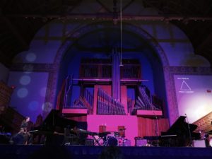 Photo of setnor auditorium interior in a purple light